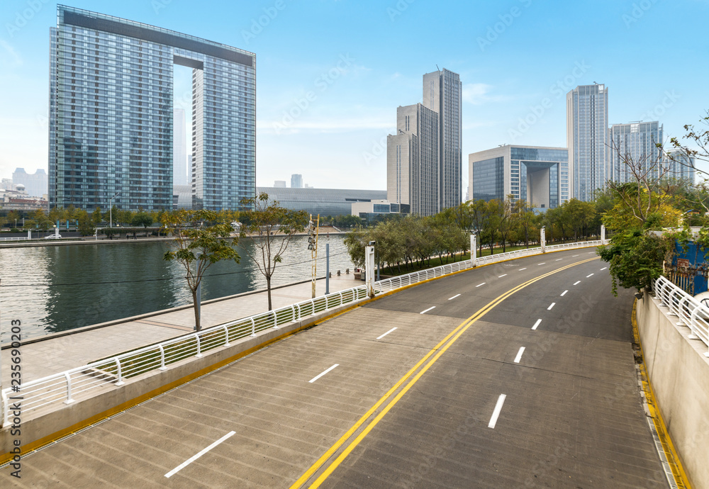 Obraz premium Empty road floor surface with modern city landmark buildings of hangzhou bund Skyline,zhejiang,china