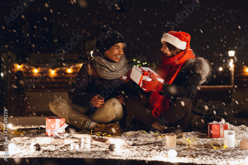 Cheerful young couple dressed in winter clothing