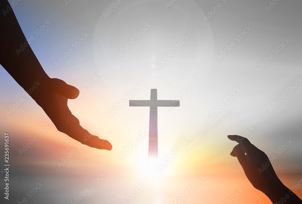 Jesus helping hand concept：World Peace Day Help hand on sunset background