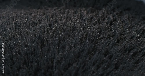 Iron powder under the influence of a magnetic field. Abstract background.