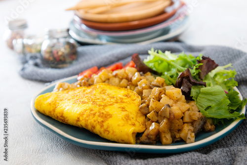 French Omelette with Potatoes, Mushroom and Salad