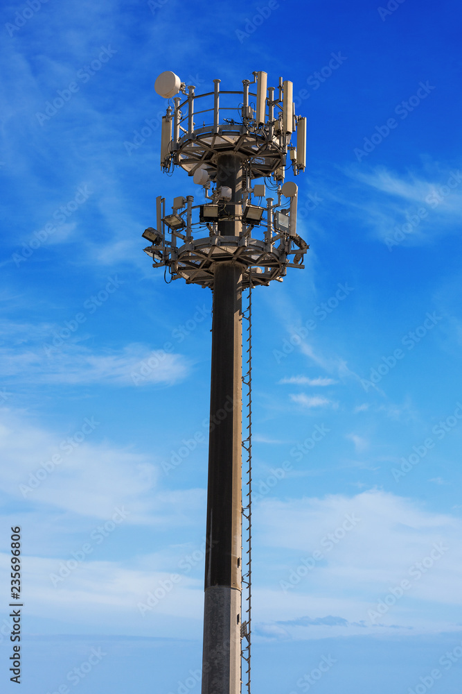 Telecommunications Antennas Tower on Blue Sky Telecommunications Antennas Tower on Blue Sky