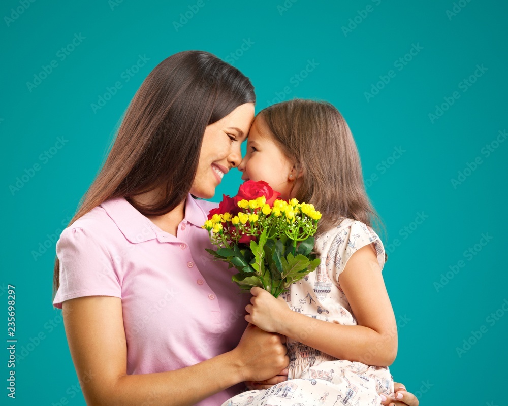 Happy Mother and daughter together with flowers Happy Mother and daughter together with flowers