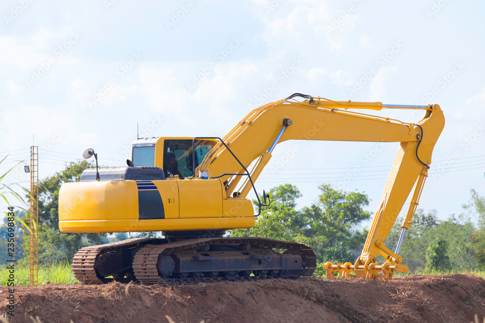Yellow backhoe in the construction site, backhoe for construction. Yellow backhoe in the construction site, backhoe for construction.