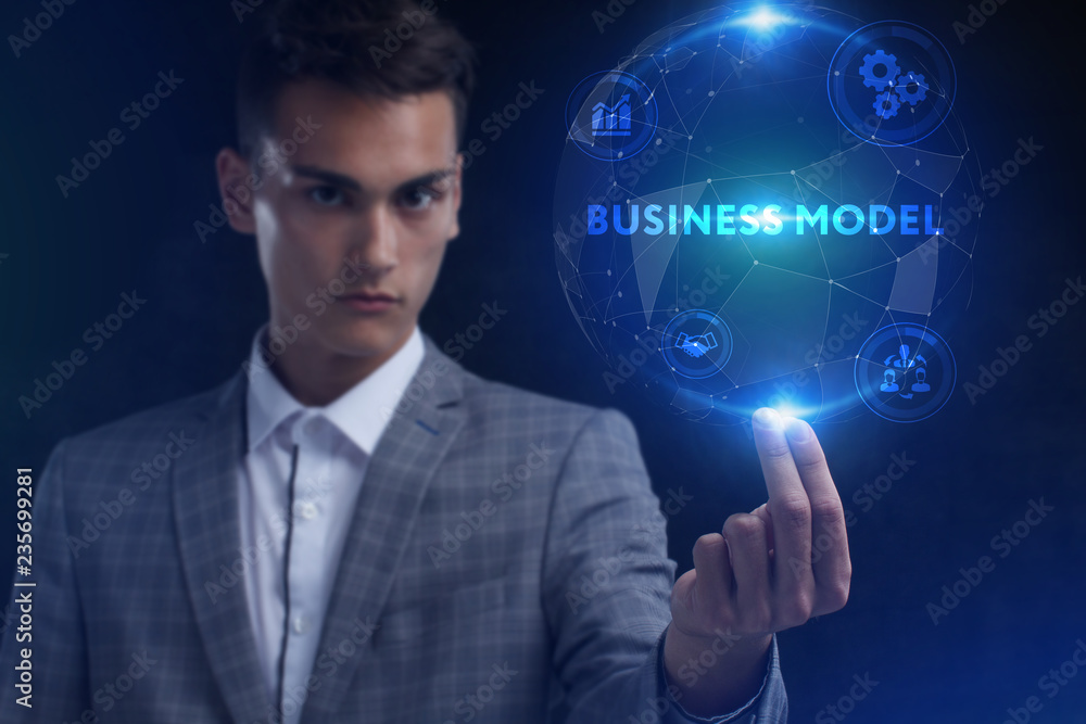 The concept of business, technology, the Internet and the network. A young entrepreneur working on a virtual screen of the future and sees the inscription: Business model The concept of business, technology, the Internet and the network. A young entrepreneur working on a virtual screen of the future and sees the inscription: Business model