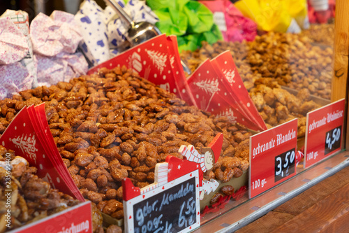 Gingerbread traditional christmas sweets of nuts in sugar at German Christmas Market stand