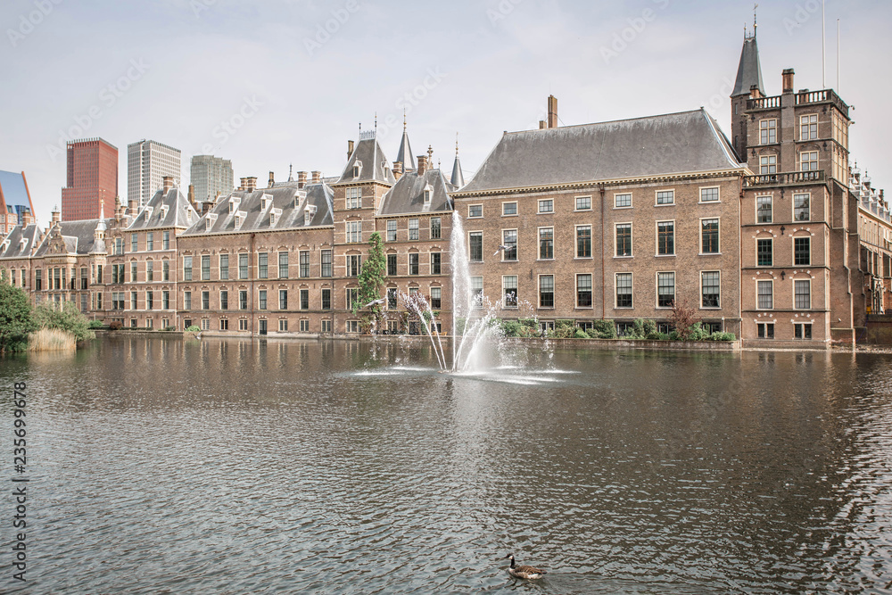Amazing Binnenhof Palace in The Hague (Den Haag). Dutch Parliament buildings. Famous castle with fountains in front of it. The Netherlands, The Hague. 