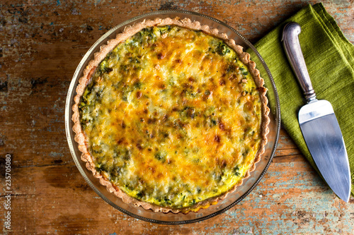 Overhead view of scallion and celery quiche served on plate