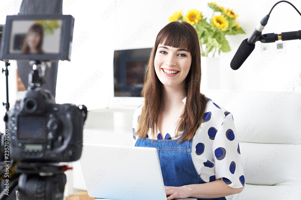 Portrait Of Female Vlogger Recording Broadcast At Home Portrait Of Female Vlogger Recording Broadcast At Home