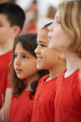Group Of Children Singing In Choir Together