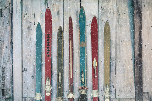 Vintage wooden weathered ski's in winter during snow