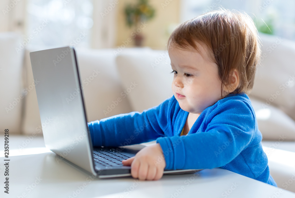 Little toddler boy with a laptop computer Little toddler boy with a laptop computer