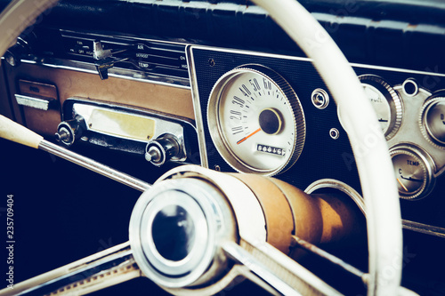 Vintage car steering wheel and dashboard
