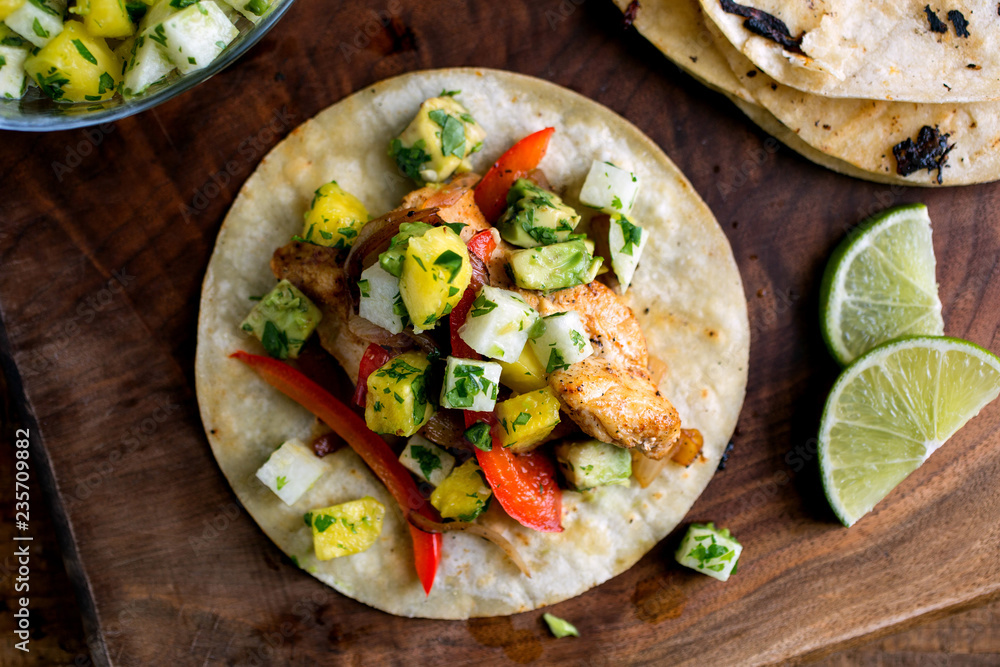 Close up of pineapple and avocado salsa on tortilla Close up of pineapple and avocado salsa on tortilla