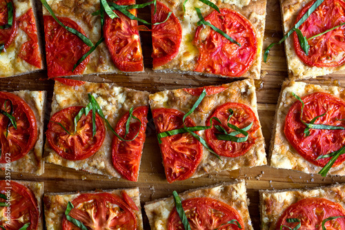 Close up of tomato focaccia slices photo