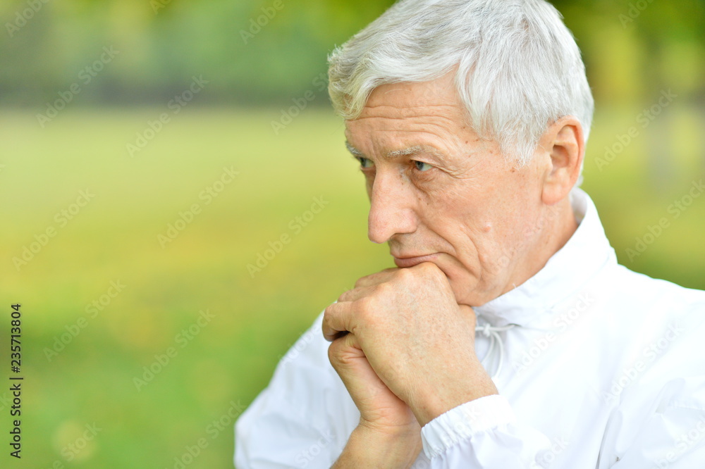 Portrait of thoughtful senior man in park Portrait of thoughtful senior man in park