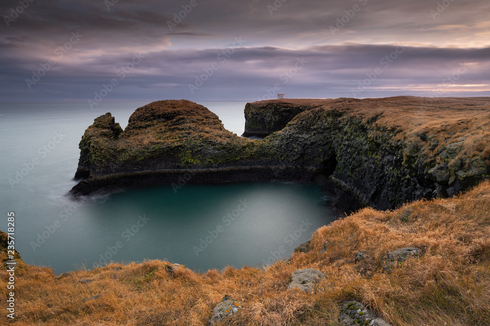 Volcanic cliffs and basalt rocks in Arnarstapi, Iceland