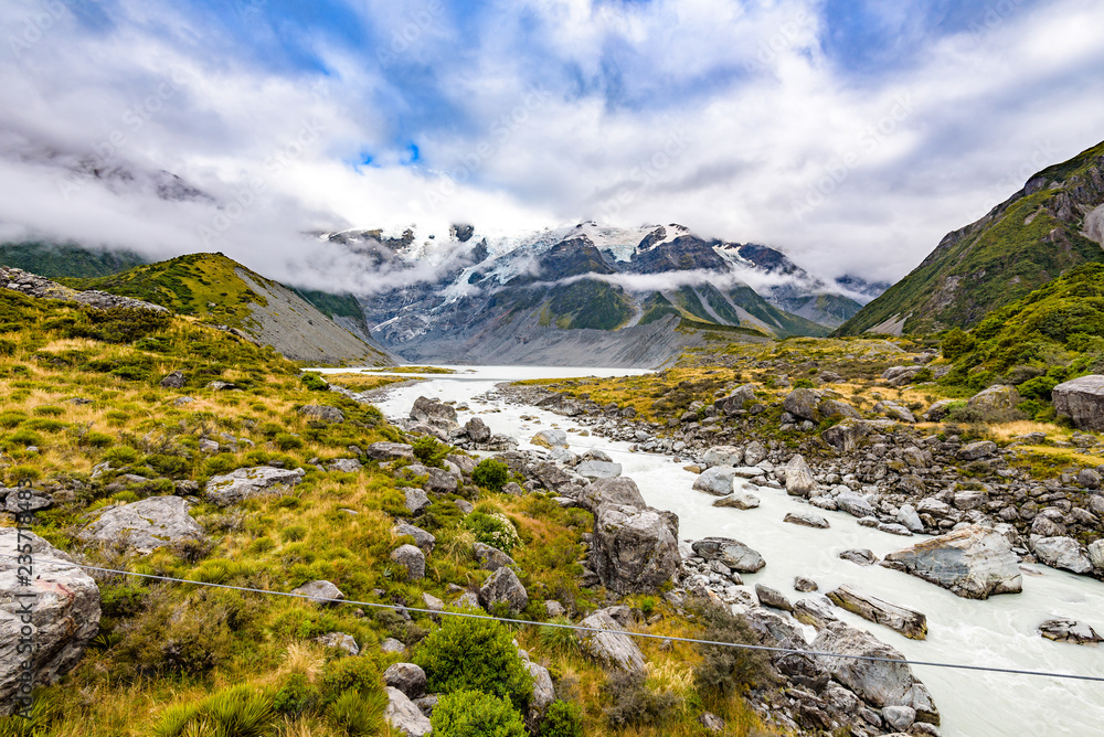 Amazing beautiful landscape at Hooker Valley Track, a breathtaking place in Aoraki, New Zealand. It is a famous tourist attraction surrounded by alpine mountain meltwater streams, glacier and lakes.