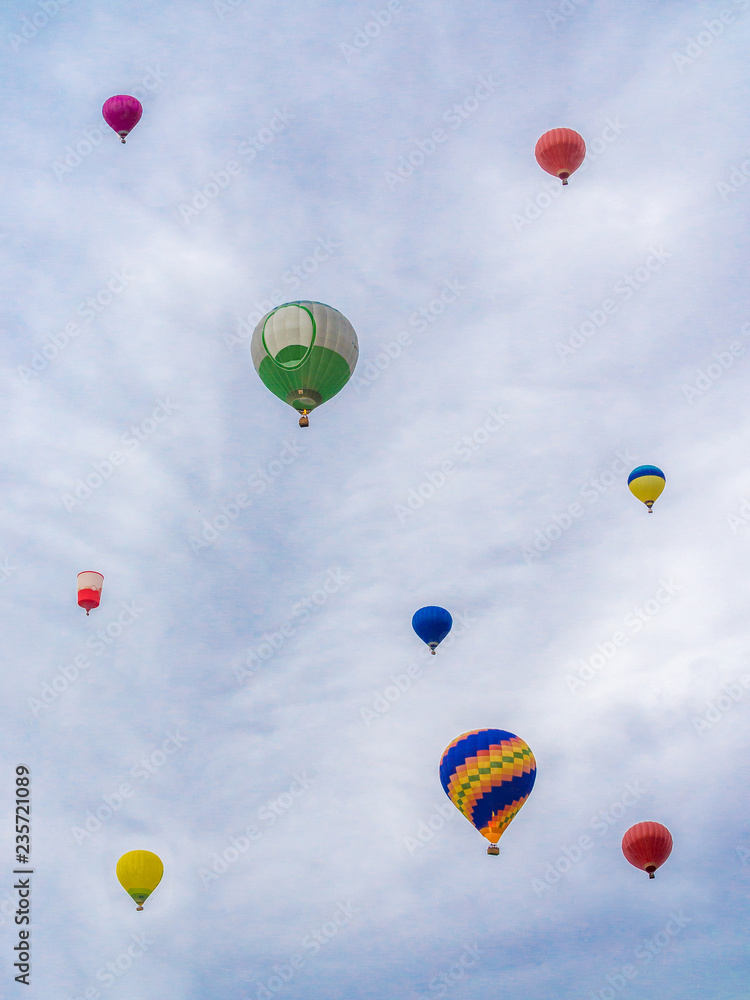Nine balloons bottom view on the evening sky background Nine balloons bottom view on the evening sky background