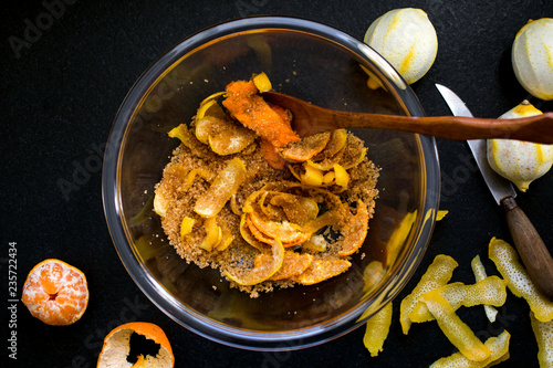 Overhead view of orange and lemon peels in a bowl photo