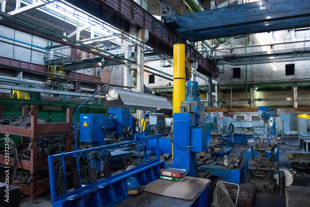 Machine shop of metallurgical works indoors room. Shop blacksmithing plant. Industrial tourism