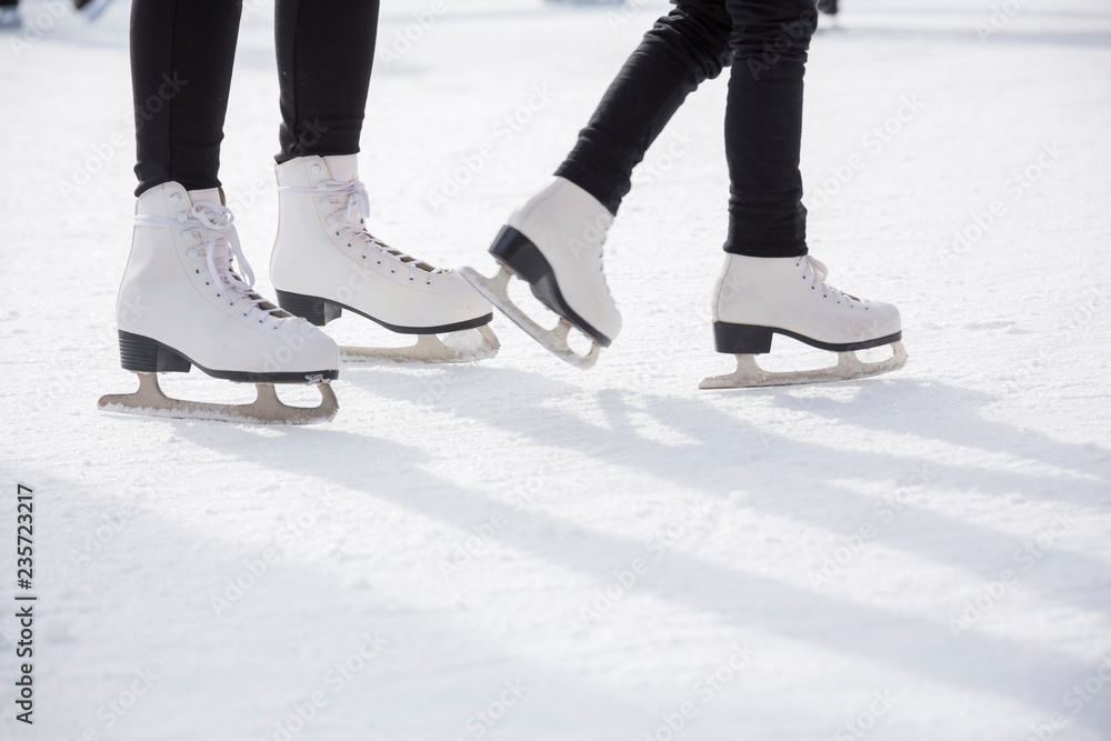 People ice skating on ice rink People ice skating on ice rink