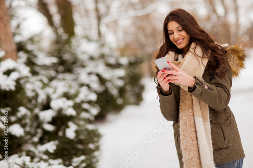 Smiling young woman with ce...