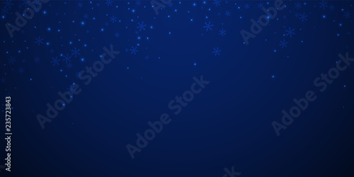 Sparse glowing snow Christmas background. Subtle f