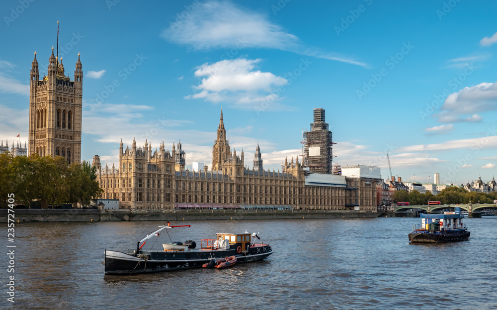 Palace of Westminster and The Houses of Parliament, London, with St. Stephen's Tower (Big Ben) shrouded in scaffolding due to repairs.