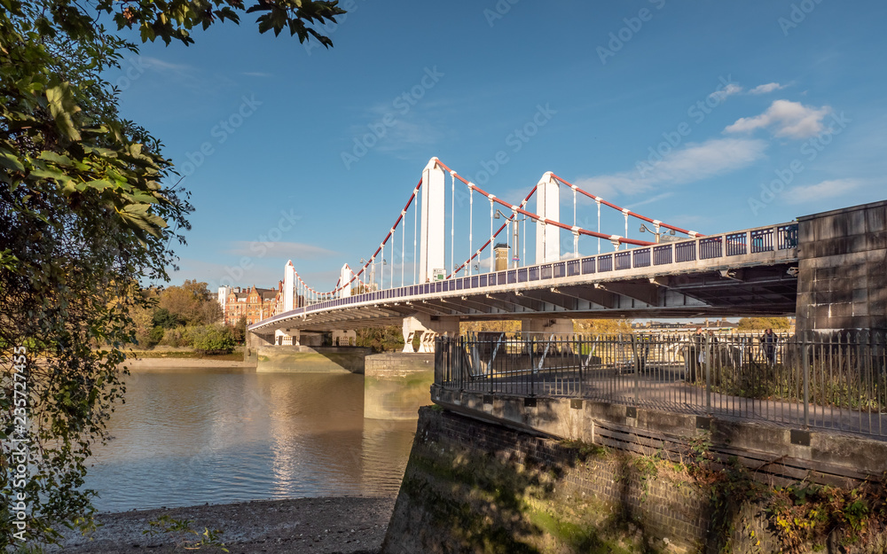 Chelsea Bridge, London. A view from the south bank of the River Thames on a bright autumnal day.