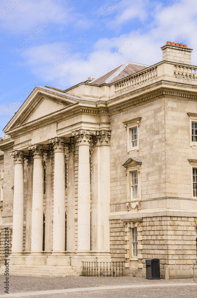 Elegant building with Corinthian columns and portico at Trinity College in Dublin, Ireland