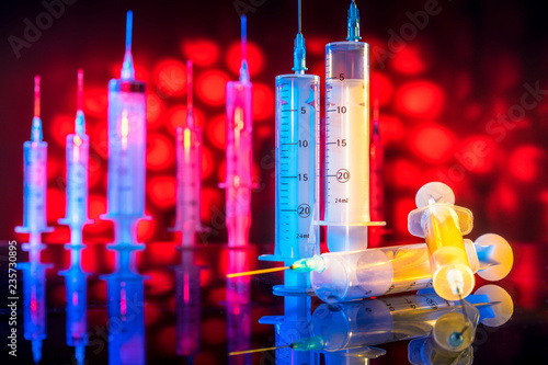 Vaccines. Syringes. Red blo...