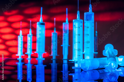 Vaccines. Syringes. Red blo...