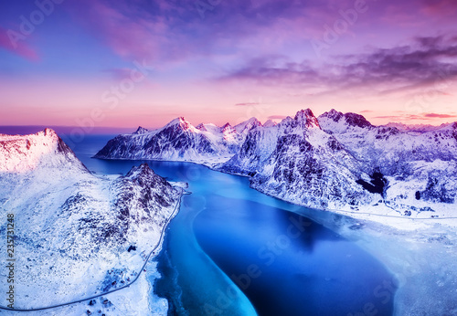 Aerial view at the Lofoten islands, Norway. Mountains and sea during sunset. Natural landscape from air at the drone. Norway at the winter time photo