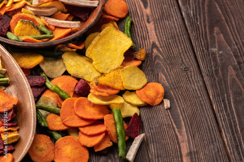 Dried vegetables chips from carrot, beet, parsnip and other vegetables. Organic diet and vegan food.