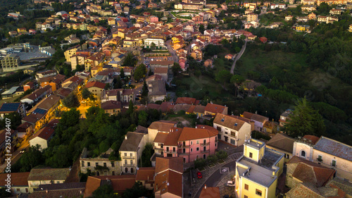 Aerial view at sunset of the small town of Montecalvo Irpino, in the province of Avellino, in Italy. This village with few houses and streets is built in the mountains of Irpinia