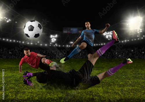 Football player in action on a dark arena © Andrey Burmakin