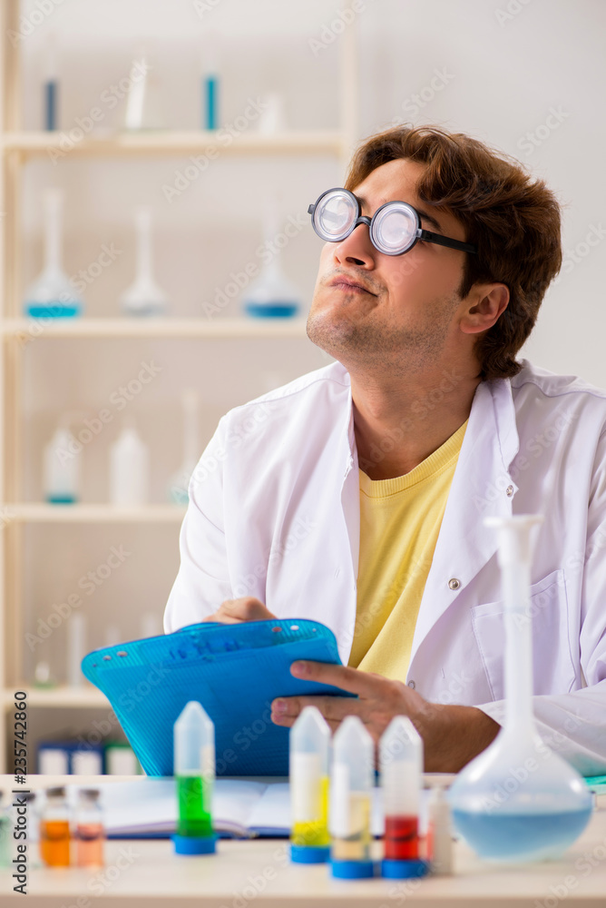 Funny crazy chemist doing experiments and tests Funny crazy chemist doing experiments and tests