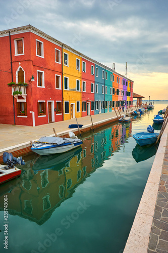 Burano island canal, colorful houses and boats, Italy. © Ryzhkov Oleksandr