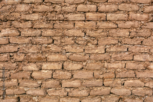 adobe brick background in desert, photo