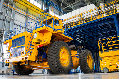 Big mining truck in the production shop of the car factory. Belaz is a Belarusian manufacturer of haulage and earthmoving equipment, dump trucks, haul trucks, heavy equipment.