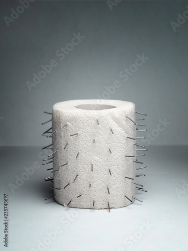 A roll of toilet paper with thorns. Unusual joke.