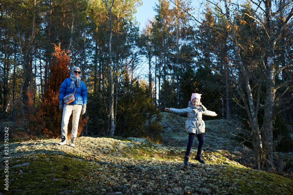 Fototapeta premium mother and little daughter travel in mountains