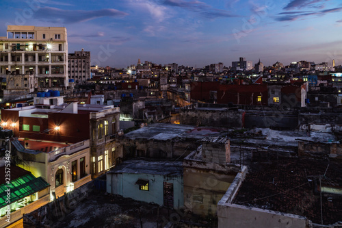 Panoramic night view over the roof tops of Havanna in Cuba right at the sunset.