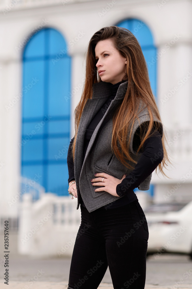 Beautiful girl in autumn day outdoors. Girl with long hair.