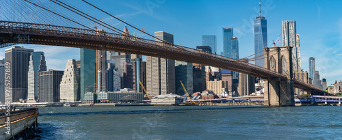 Panoramic view of Brooklyn bridge over Manhatten skyscrapers,
