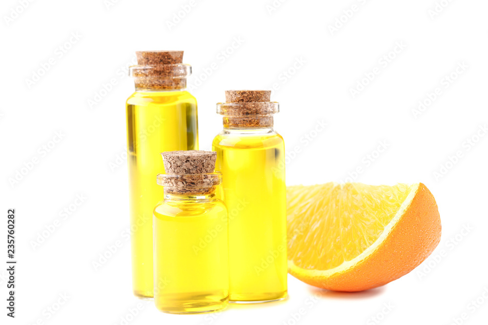 Orange oil in bottles isolated on white background Orange oil in bottles isolated on white background