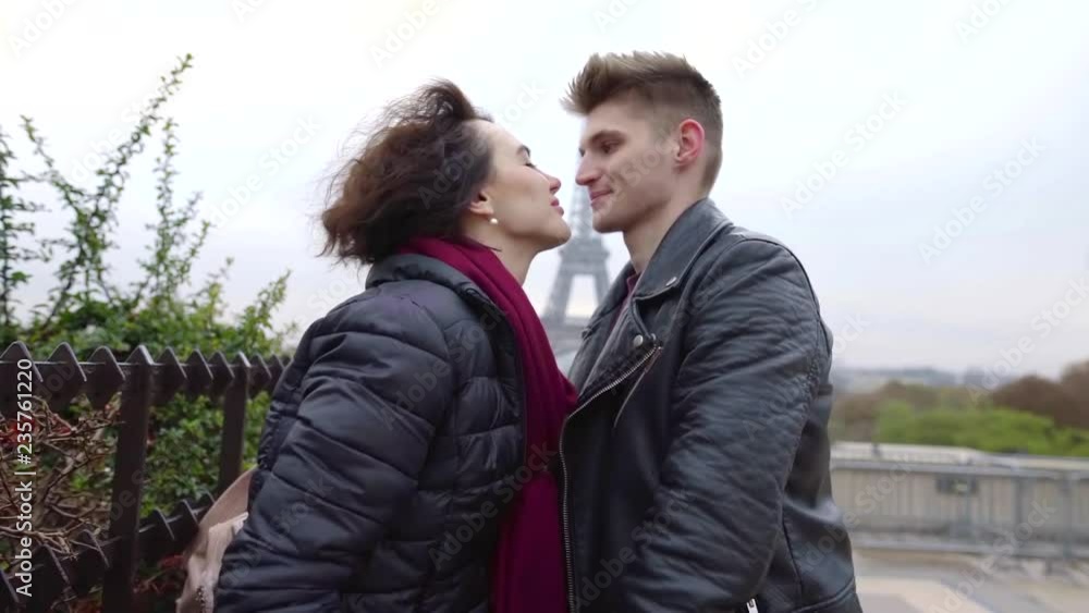 Lovely young couple kisses outdoor in autumn meeting each other, boyfriend and girlfriend taking a walk in city. Lovely young couple kisses outdoor in autumn meeting each other, boyfriend and girlfriend taking a walk in city.