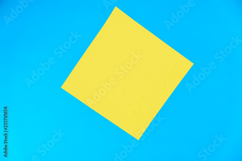 Yellow paper sticker on a blue background