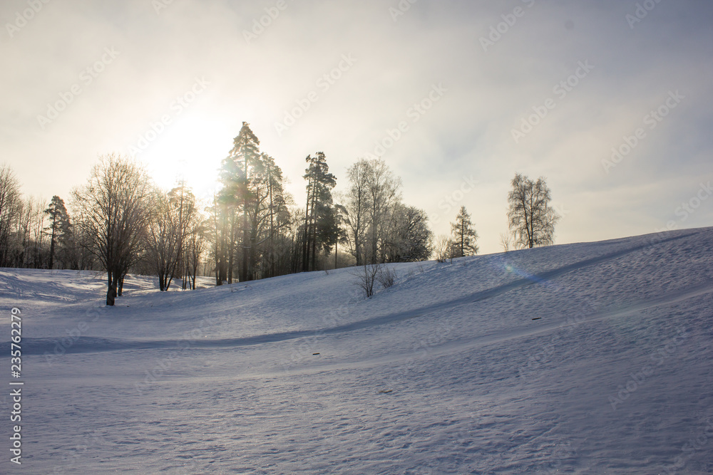 Winter landscape in clear weather. Frosty daylight at sunset Winter landscape in clear weather. Frosty daylight at sunset